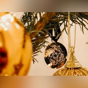 Three Diptyque Christmas Tree Ornaments